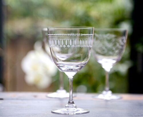 A Set Of Six Crystal Wine Glasses with Ovals Design
