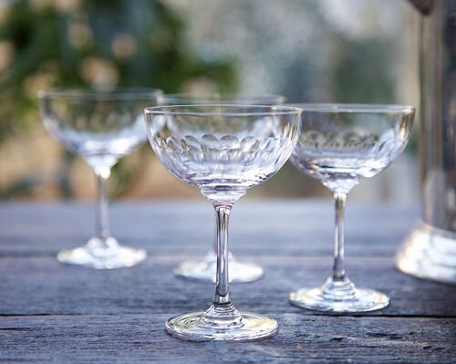 A Set of Six Crystal Champagne Saucers with Lens Design