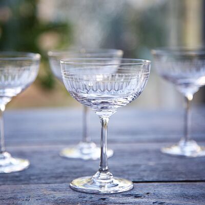 A Set of Six Crystal Champagne Saucers with Ovals Design