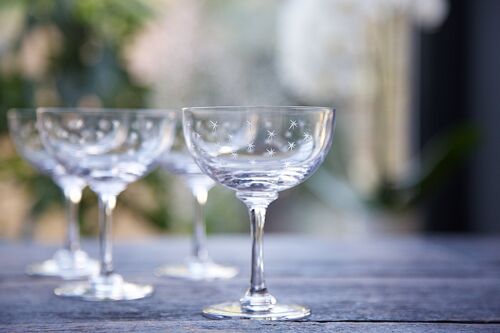 A Set of Six Crystal Champagne Saucers with Stars Design