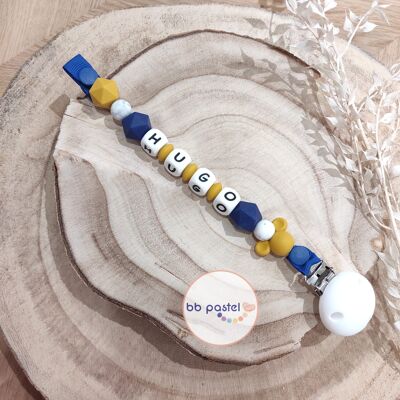 Mustard yellow and dark blue pacifier clip