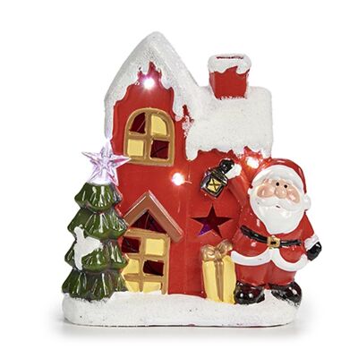 Figure of Santa Claus with a house.