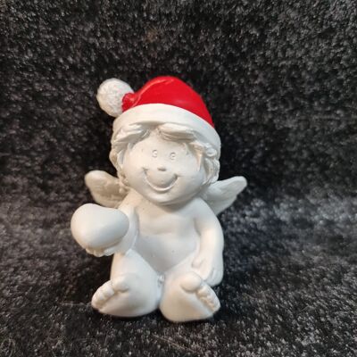 Angelo con cappello da Babbo Natale seduto 4,5 cm n. 1