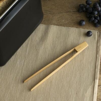 Non-magnetic toast tongs - on natural card