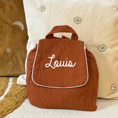 Customizable terracotta double gauze backpack with a first name