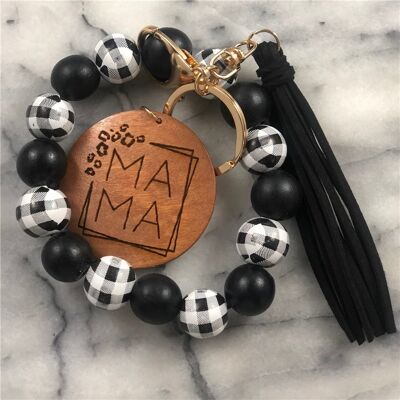 Llavero de pulsera con cuentas de madera y borlas