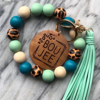 Llavero de pulsera con cuentas de madera y borlas