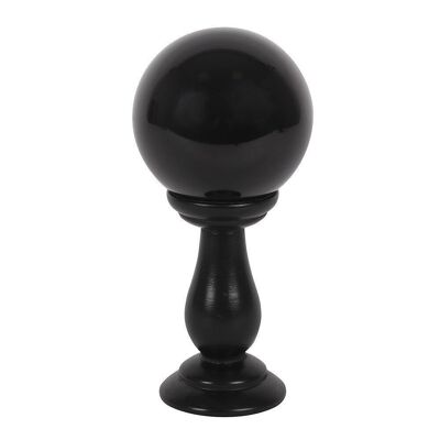 Pequeña bola de cristal negro en soporte