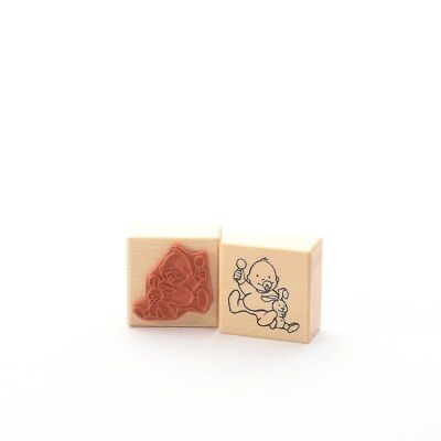 Motif stamp title: Baby with rattle and rabbit