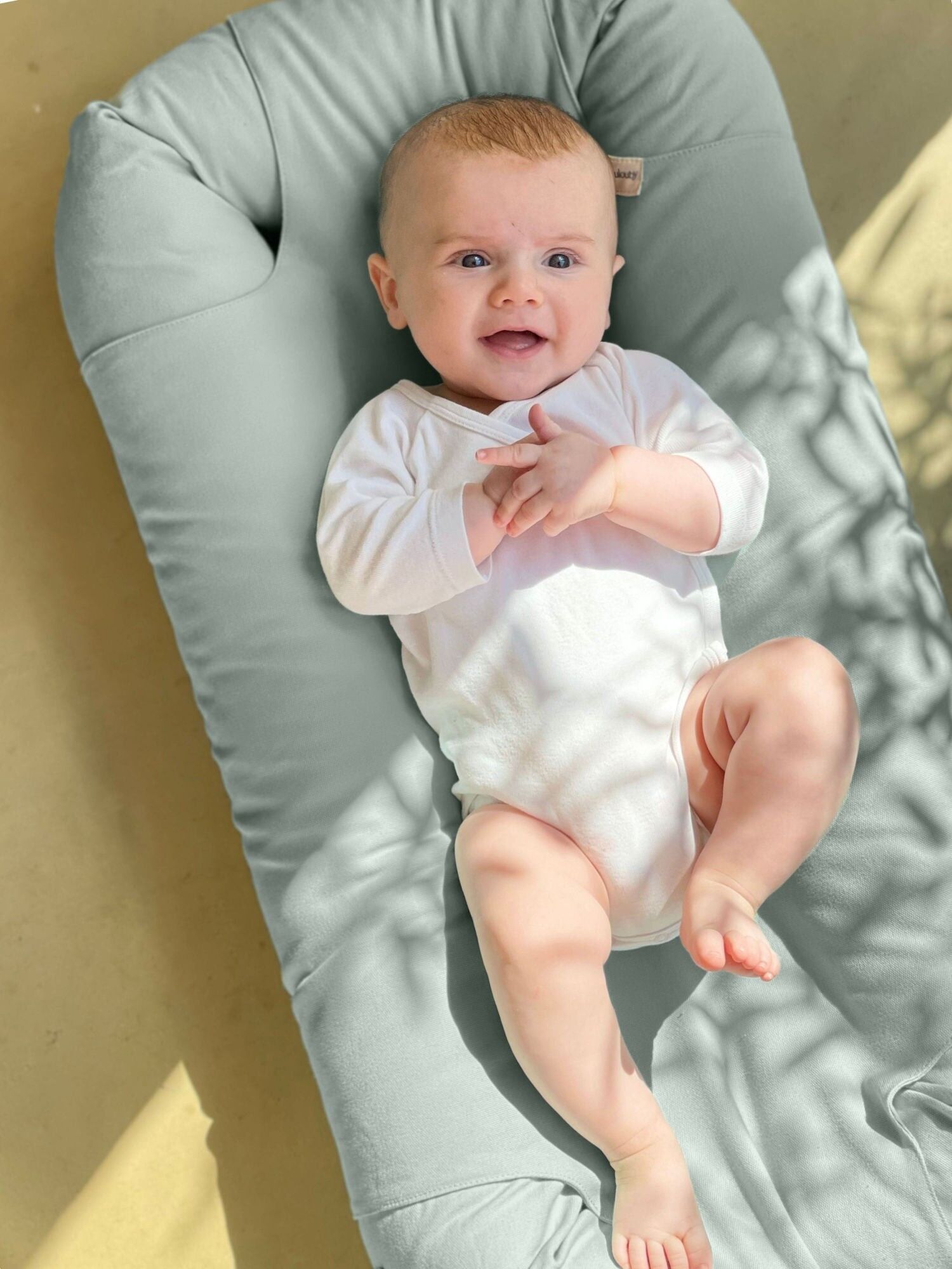 nido de bebé loulouby en azul océano