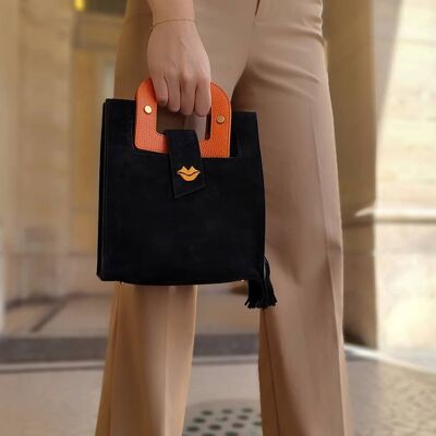 ARTIST schwarze Wildlederhandtasche, Griffe und orangefarbene Mundstickerei
