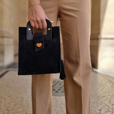 ARTIST schwarze Wildlederhandtasche, orange Mundstickerei