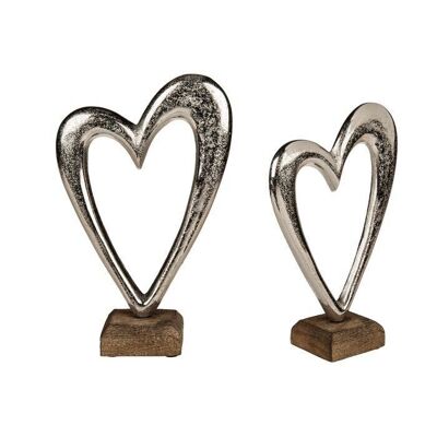 Silver-colored metal heart on a wooden base, 2