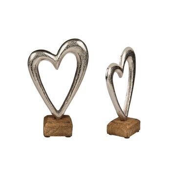 Coeur en métal argenté sur socle en bois, 1