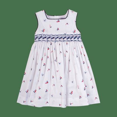 Pinafore dress with smocks in red/navy boat print available in 4Y
