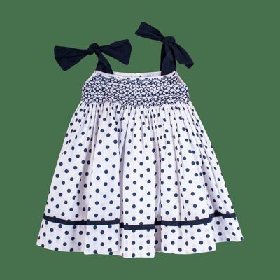 Dress with smocked straps in navy polka dots