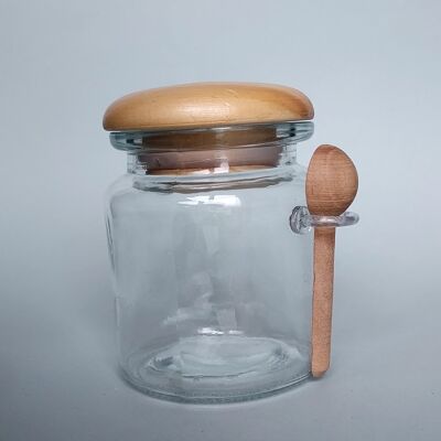 Glass jar with stopper and wooden scoop