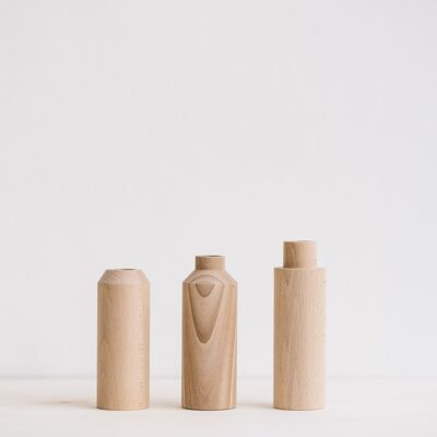 Tris di vasi in legno