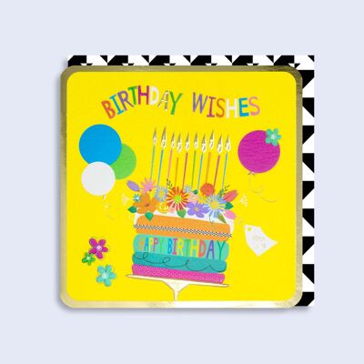 Fiori di carta al neon luminosi e torta di compleanno