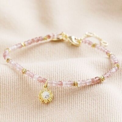 Bracelet en perles de quartz fraise avec breloque marguerite en or