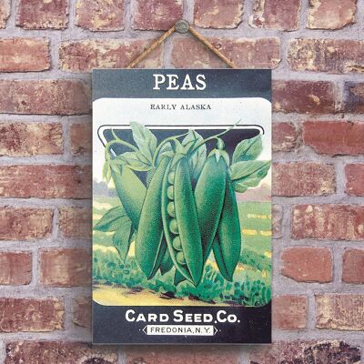 P1208 - Una tarjeta clásica de guisantes Seed Co Estilo retro Anuncio vintage en una placa de madera