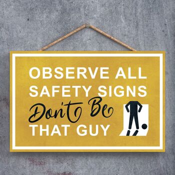 P1267 - Observez tous les panneaux de sécurité Don't Be That Guy, Male Stick Person Yellow Exit Sign On A Hanging Wooden Plaque 1