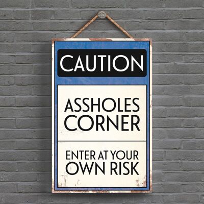 P1528 - Caution Assholes Corner Typography Sign Imprimé sur une plaque à suspendre en bois