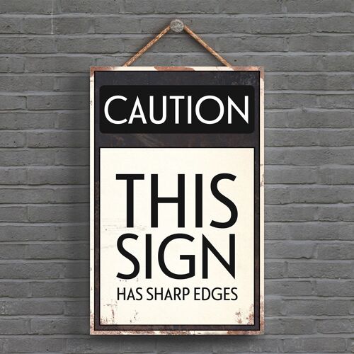 P1537 - Caution This Sign Has Sharp Edges Typography Sign Printed Onto A Wooden Hanging Plaque