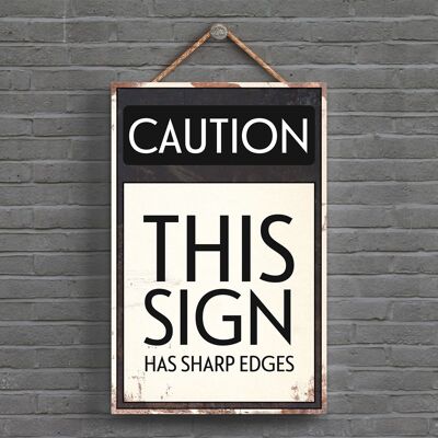 P1537 - Attention ce signe a des arêtes vives typographie signe imprimé sur une plaque à suspendre en bois