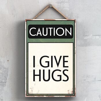 P2025 - Caution I Give Hugs Typography Sign Imprimé sur une plaque à suspendre en bois 1