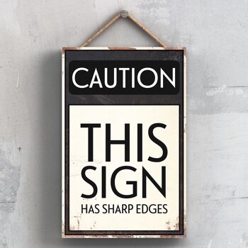 P2031 - Attention ce signe a des arêtes vives signe de typographie imprimé sur une plaque suspendue en bois 1