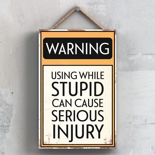 P2107 - Warning Using While Stupid Can Cause Injury Typography Sign Printed Onto A Wooden Hanging Plaque