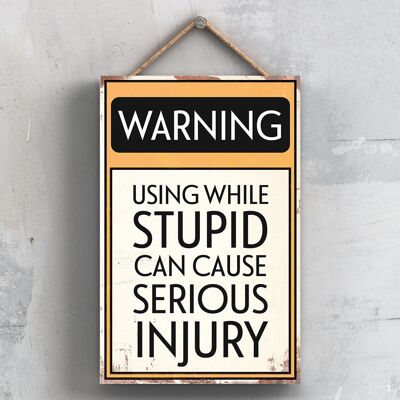 P2107 - Warning Using While Stupid Can Cause Injury Typography Sign Printed Onto A Wooden Hanging Plaque