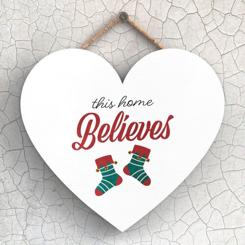 P2428 - This Home Believes Stockings Typography On A Heart Shaped Wooden Hanging Plaque