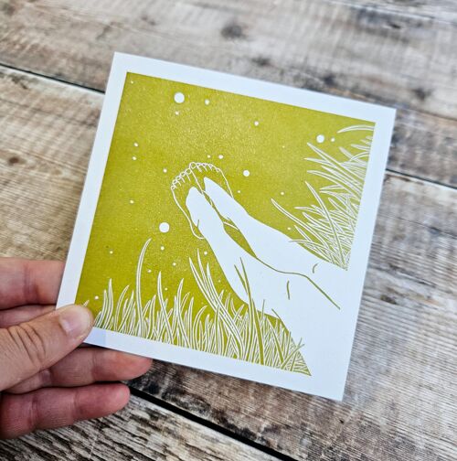 Both Feet In - Blank greeting card featuring a pair of legs resting on a bank with the feet in the water