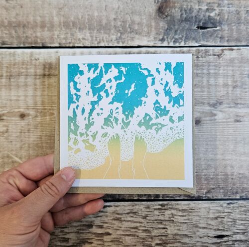 Exhale - Blank greeting card featuring feet paddling in the waves on a beach