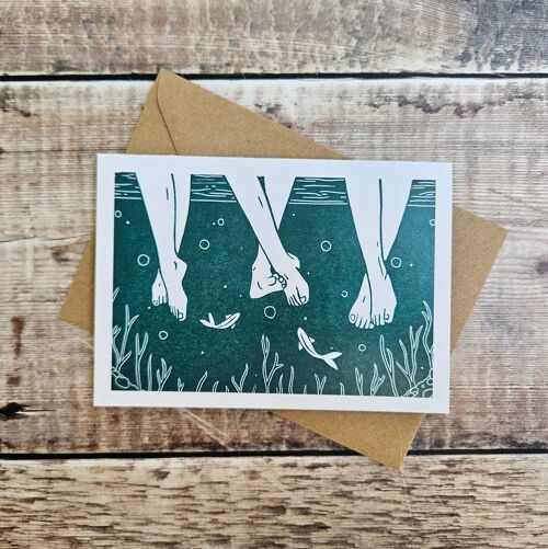 Riverside - Blank greeting card featuring three pairs of legs in a river/stream