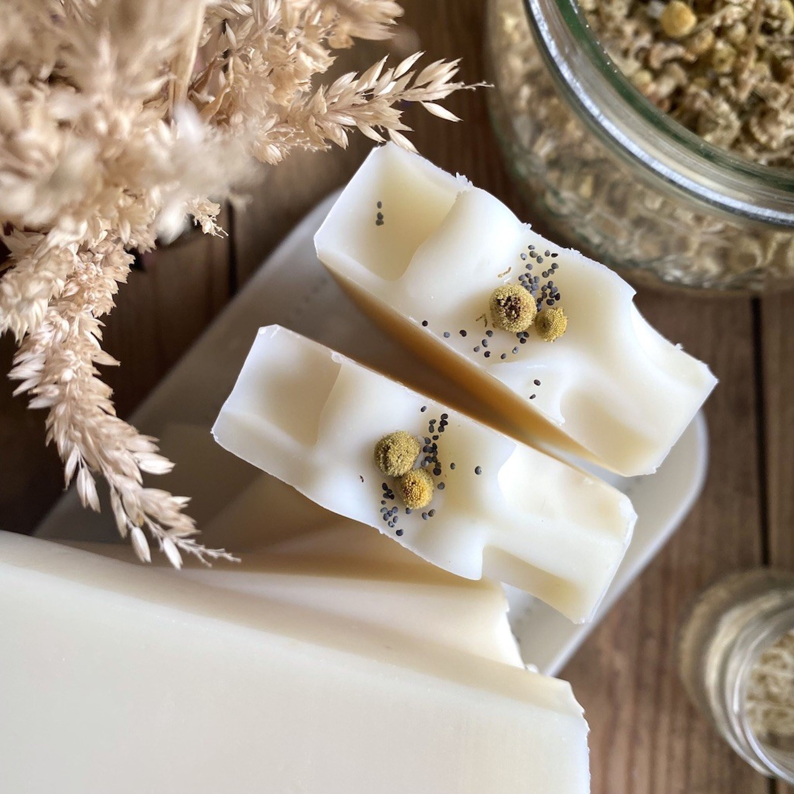 Premium Photo  Natural handmade soap with chamomile flower extract. around  are dried flowers.