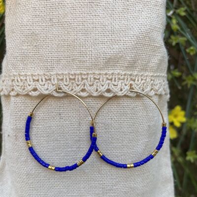 Golden hoop earrings with navy blue Miyuki pearls