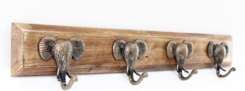 Quatre crochets dorés à motif d'éléphant sur une base en bois 1