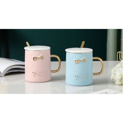 Ceramic mug with cup and golden spoon and handle