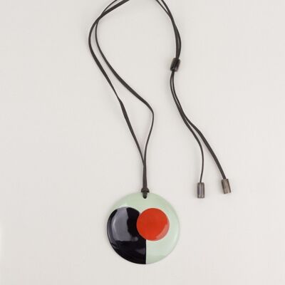 Metamorphosis pendant in black horn and orange and green lacquer