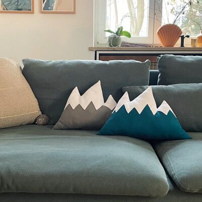 Organic cotton throw pillow in the shape of a mountain