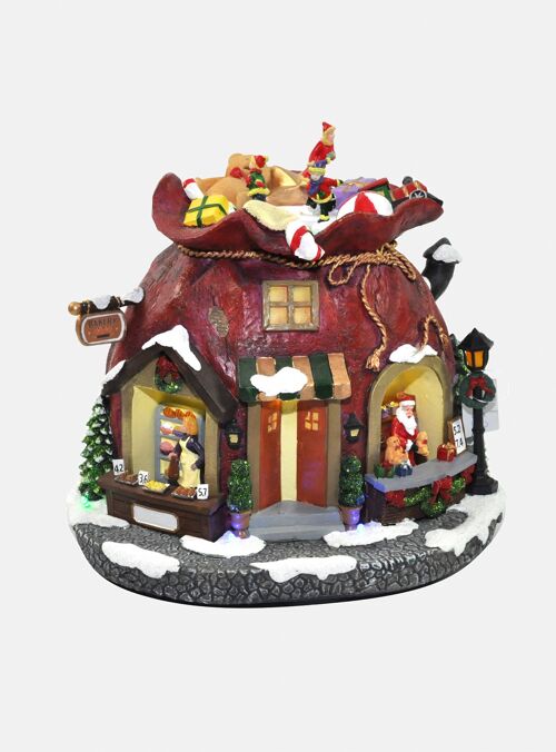 Dmora Statuetta natalizia con luci LED e musica, Villaggio Babbo Natale, Giostrina in movimento, Decorazione natalizia, cm 24,5x21x22,5