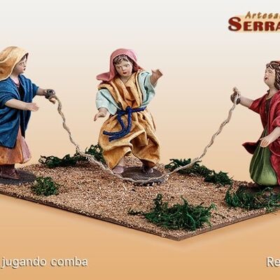 3 girls playing jump rope, nativity scene figure