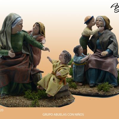 Grandmother and two children kissing, figures of the nativity scene