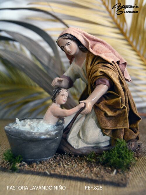 Pastora lavando niño, figura del belén