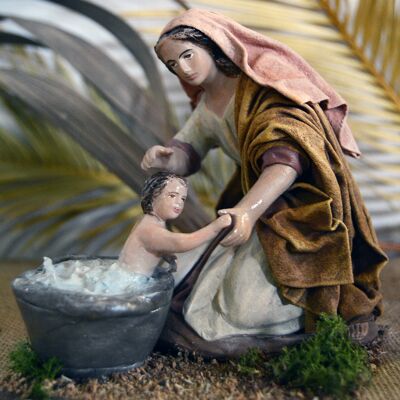 Pastora lavando niño, figura del belén