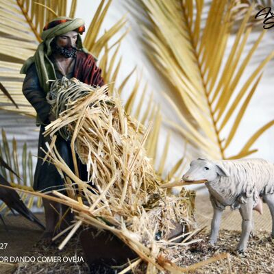 Berger nourrissant les moutons, figure de la crèche