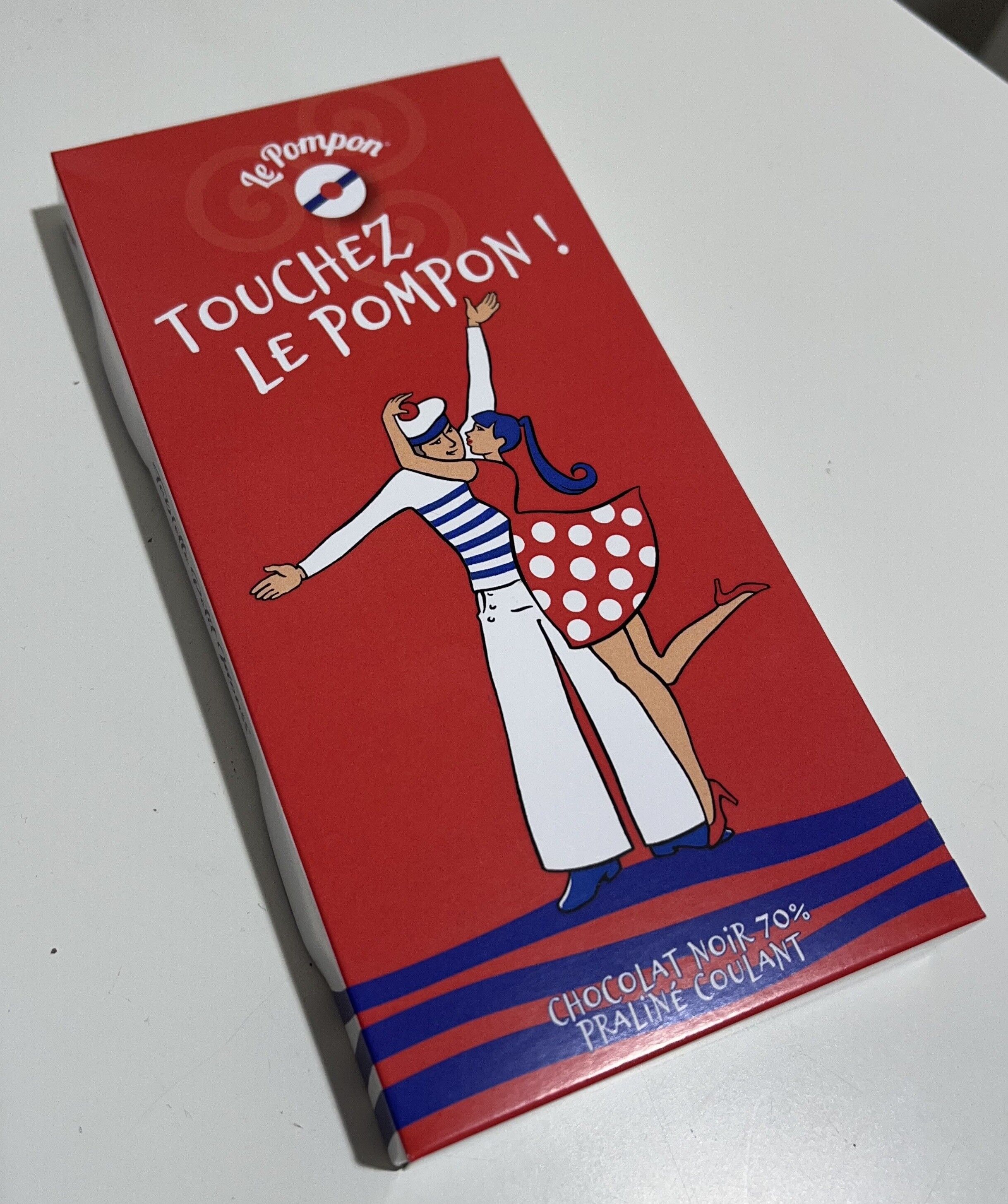 Tavoletta rossa "Tocca il pompon"